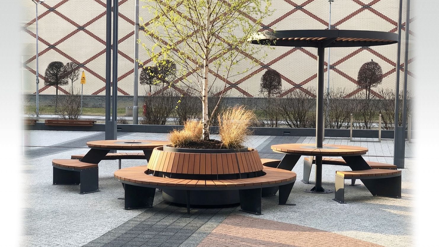 Steel modular benches with a roof and a tree planter