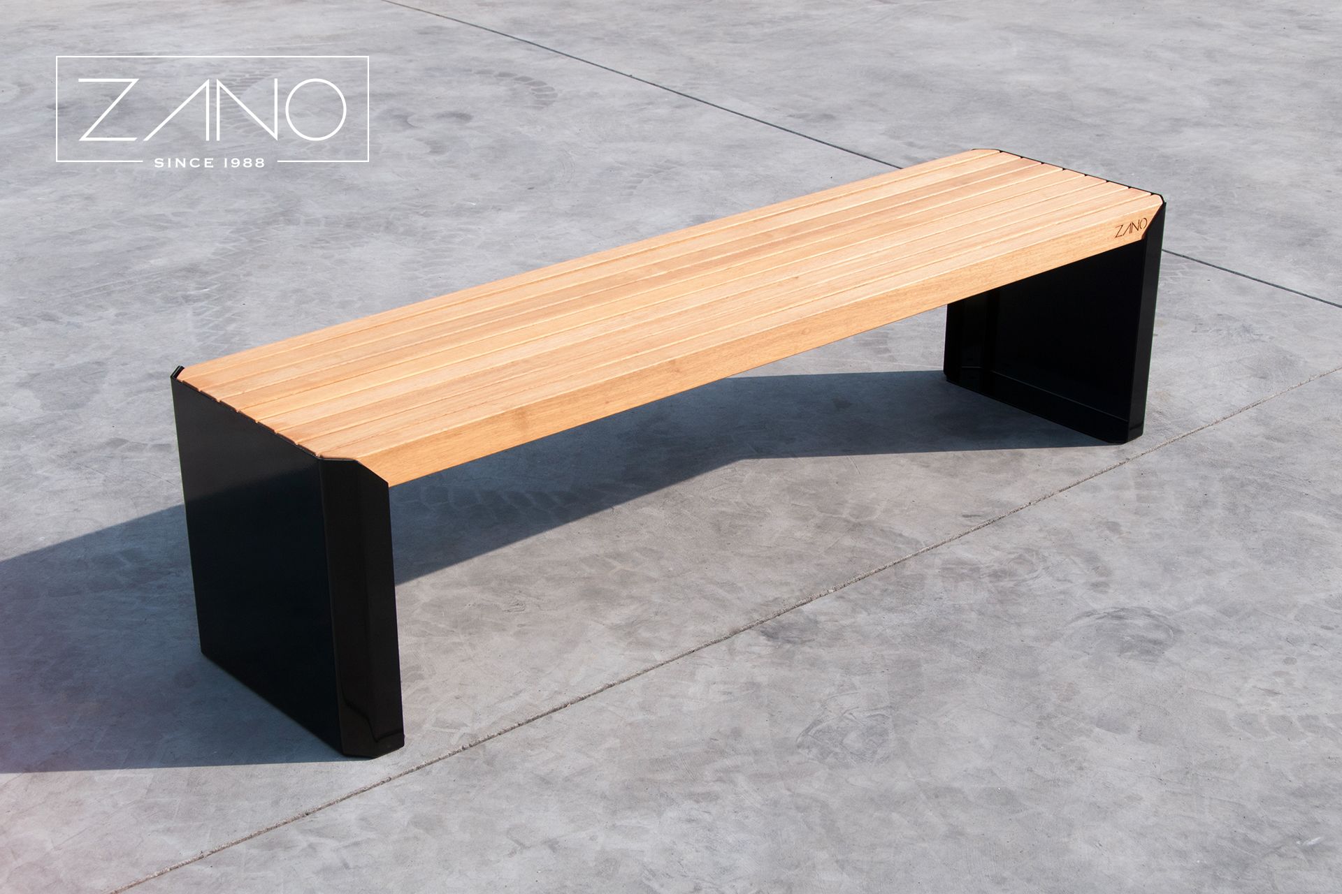 Steel-framed city bench with exotic tauari wood